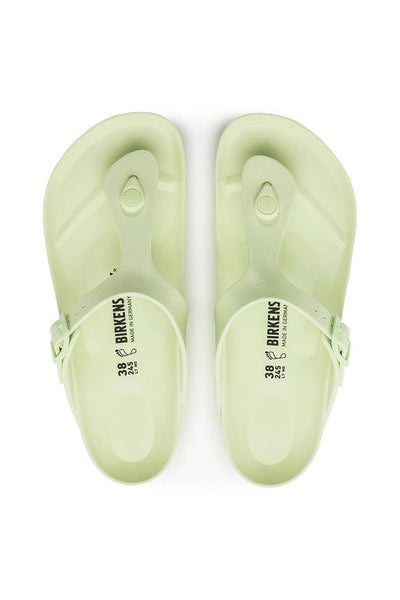 overview photo of the pale lime green T barr rubber sandals