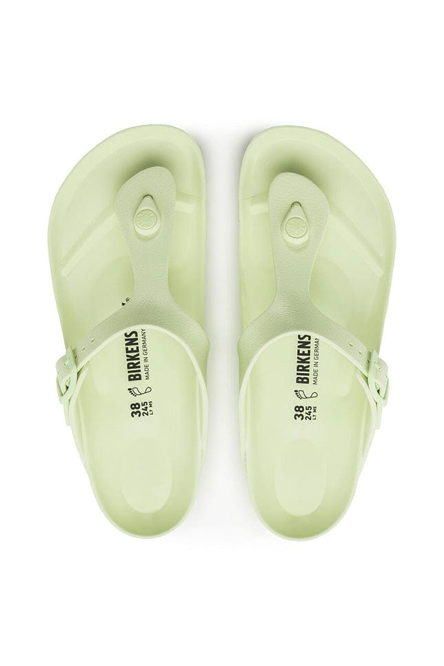 overview photo of the pale lime green T barr rubber sandals