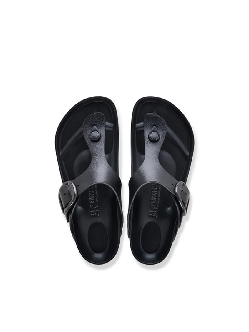 A pair of black silicone slide sandals shown from a top-down view on a clean white background.