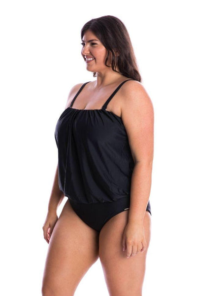 Brunette curve model wearing black flattering bandeau one piece with adjustable straps