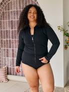 Model wears a long sleeve rashie with full zip detail