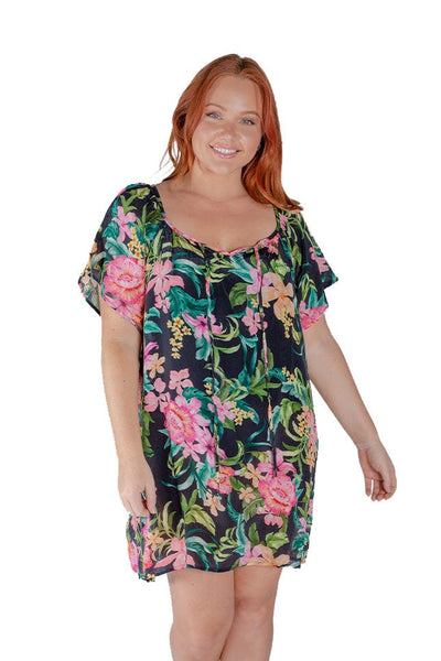 Red hair model wears black floral cover up dress