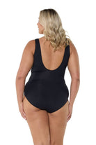 Model showing back of black and white square neck one piece