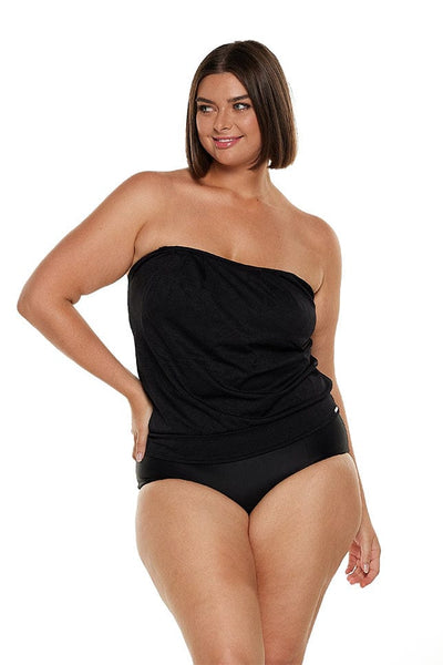 Brunette plus size model wears strapless bandeau tankini top in black textured fabric