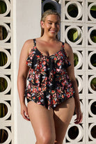 Blonde model by pool wearing ruffle tankini top with floral print