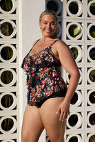 Side profile of curve model wearing tankini with ruffle detail in multi coloured floral print