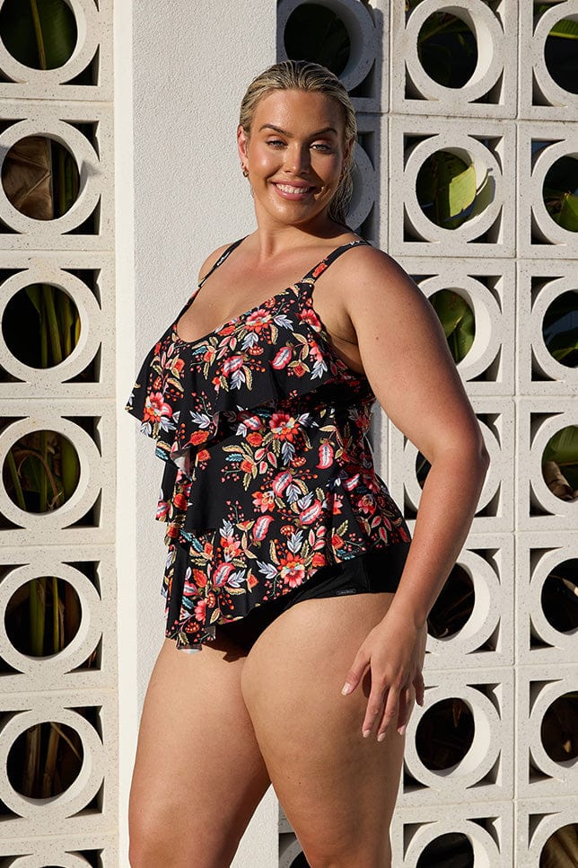 Side profile of curve model wearing tankini with ruffle detail in multi coloured floral print