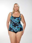 Blonde women shows front of square neck tankini top in blue floral design