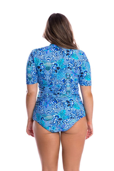Model showing back of blue patterned rash vest