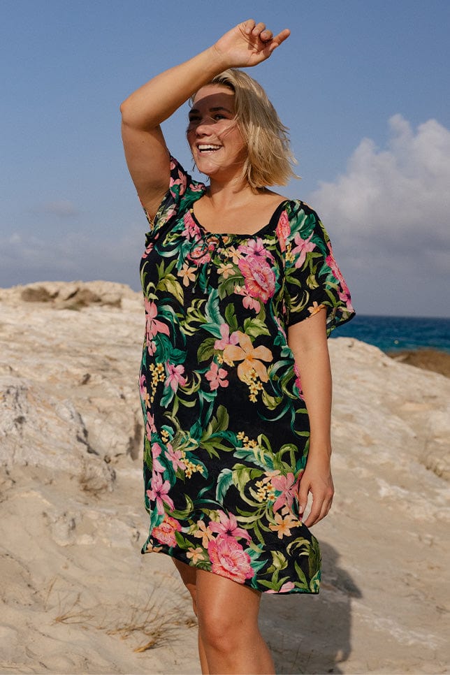 Blonde plus size model wearing wearing swim cover up dress 