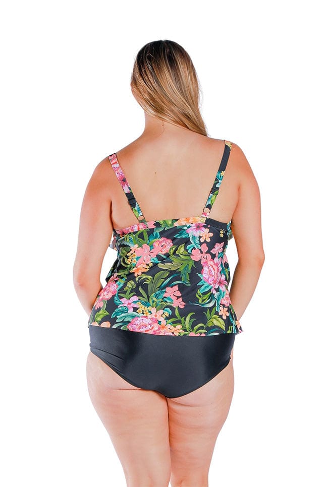 Model wearing floral and black three tiered frill tankini top 