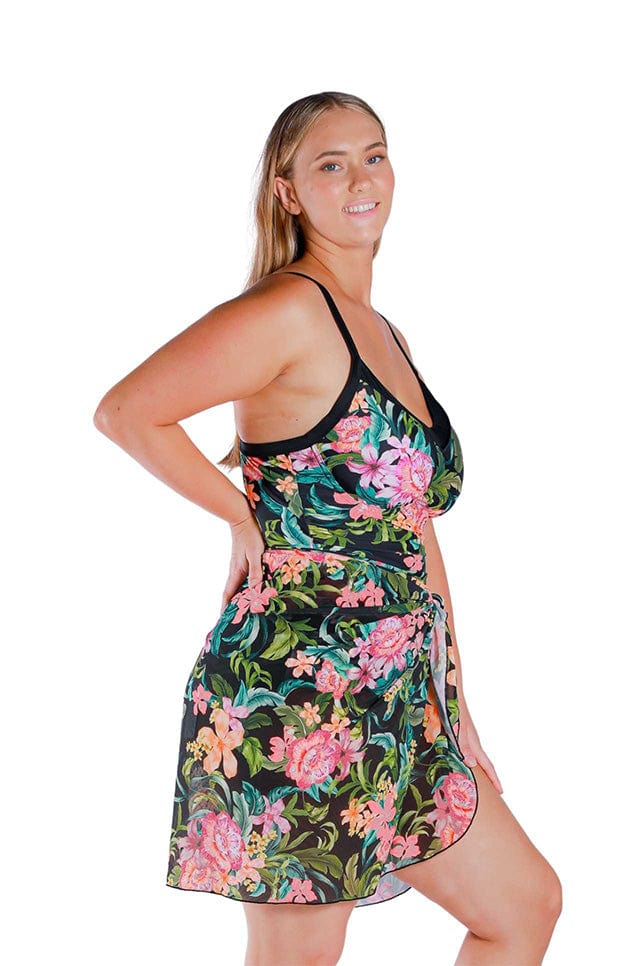 Model wearing floral and black printed long mesh wrap skirt swim cover up
