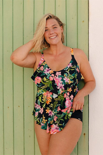 Blonde model wearing tropical bora bora plus size ruffle one piece