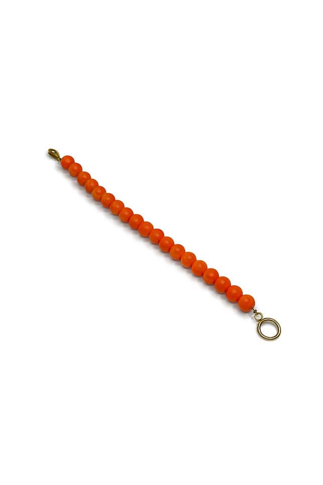 Orange buildable chain necklace with gold clasp and hanging charms