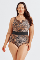 Woman wearing a leopard print swimsuit on a white background