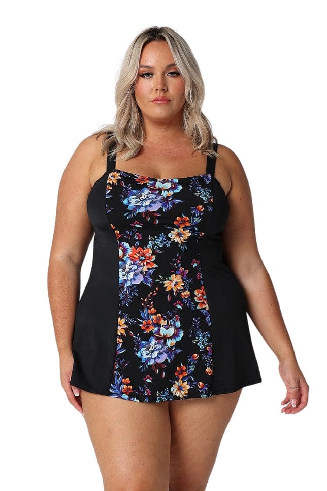 Blonde model in studio wearing curvy orange and blue floral swim dress in chlorine resistant fabric