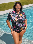 Woman wearing a floral swimsuit by a pool