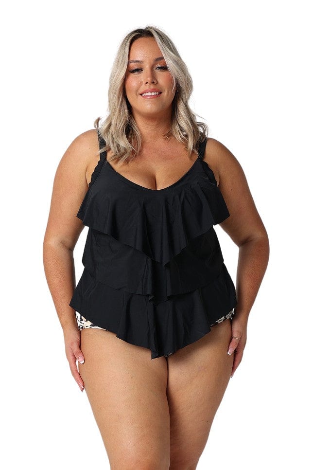 Blonde model in studio wearing a black ruffled tankini top for curve women
