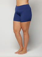 Blue chlorine resistant worn by a person on a plain background