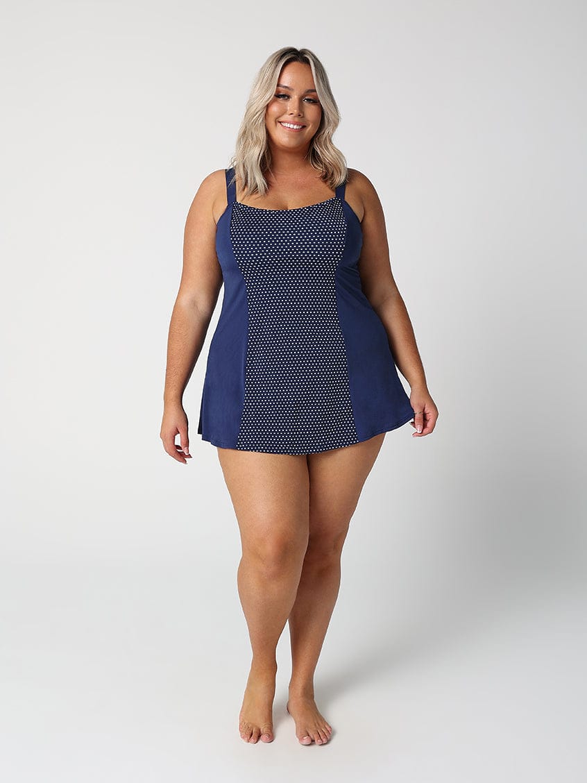 Woman wearing a blue patterned dress on a white background