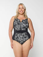 Blonde women in studio wearing plus size one piece with half zip detail in chlorine resistant fabric