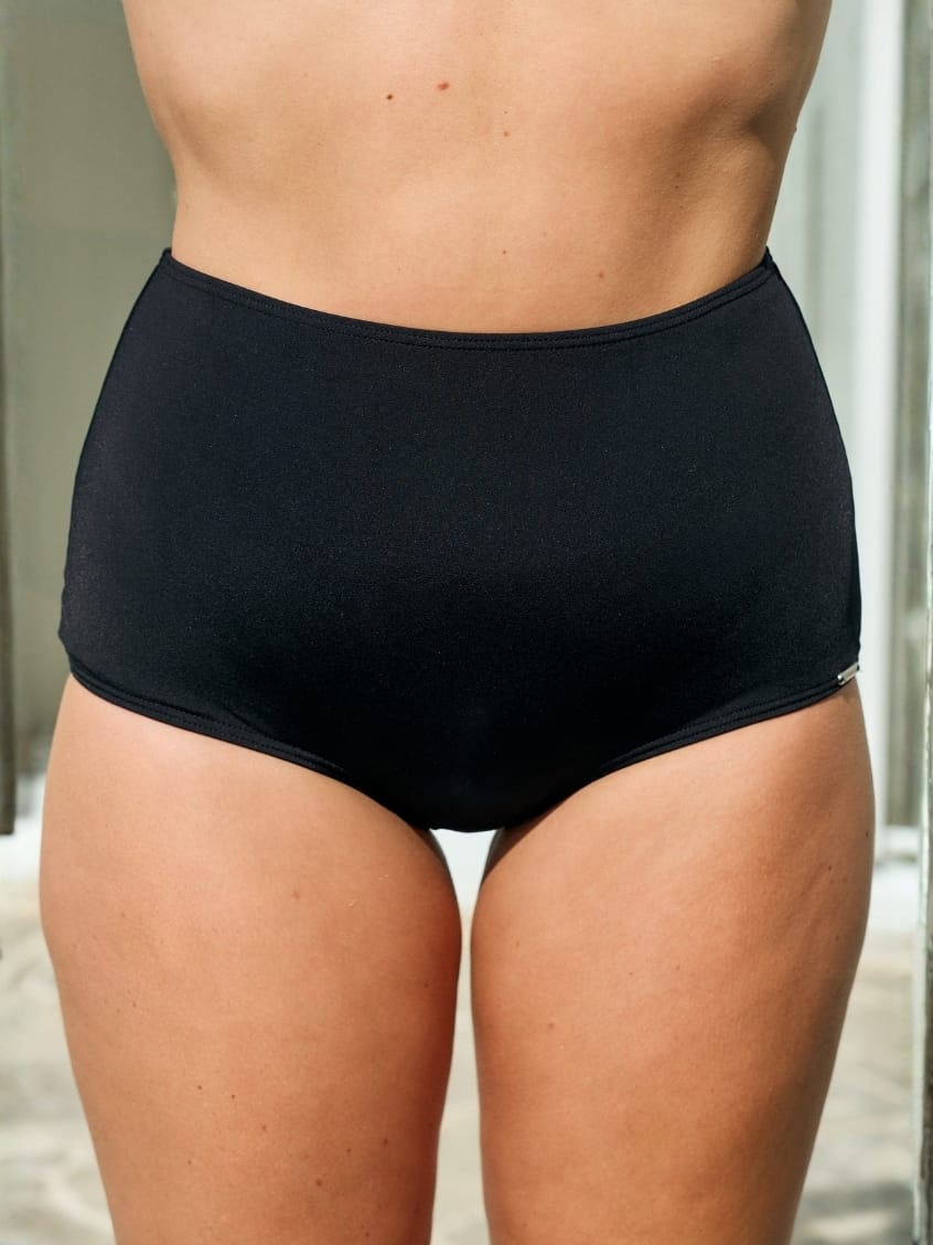 Model wearing a black high waisted pant in chlorine resistant