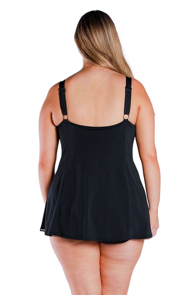 back of plus size model wearing a black chlorine resistant swim dress