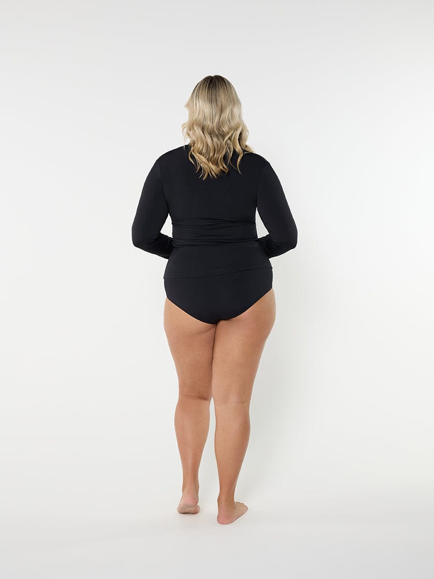 Person wearing a black swimsuit on a white background