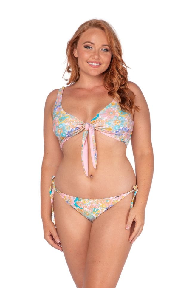 Curve women wearing retro floral low rise swim bottoms with tie side detail Australia