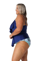 Side of blonde model in studio wearing three tiered tankini top in metallic navy colour