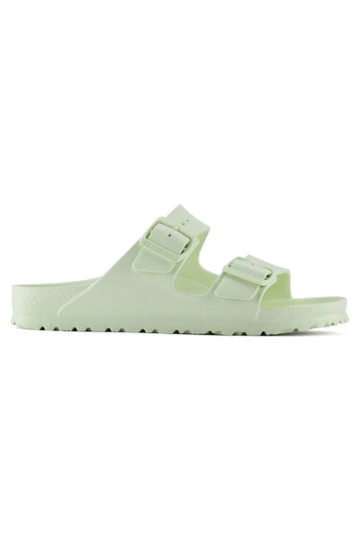 side profile of lime green sandals with 2 straps and buckles