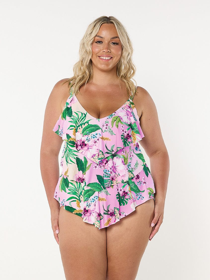 Woman wearing plus size tiered tankini top in pink floral