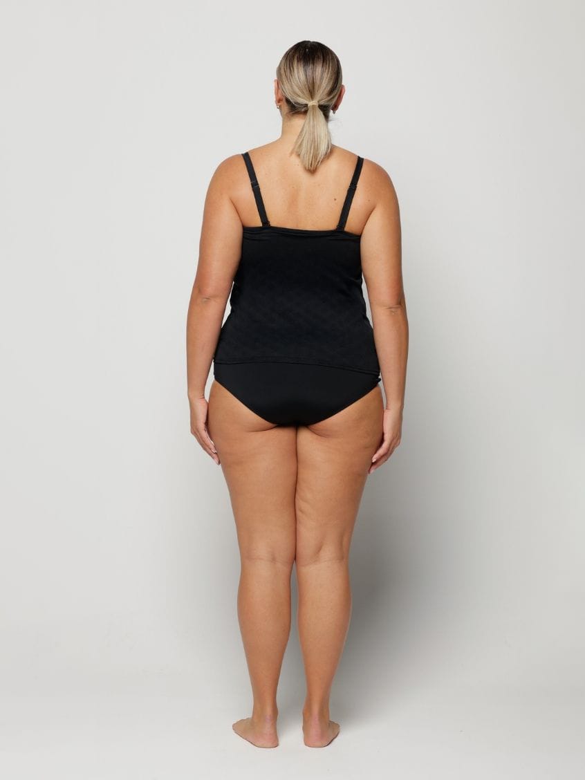 Woman against a plain background