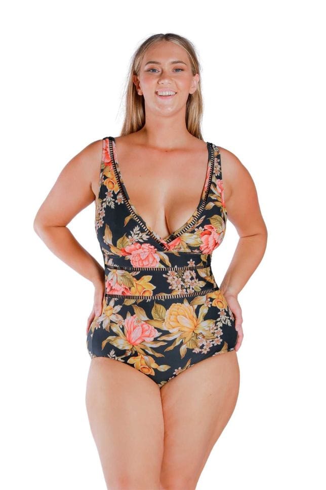 Model wearing floral and black printed V neck one piece