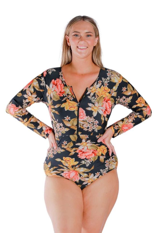Model wearing yellow and orange floral black printed long sleeved one piece