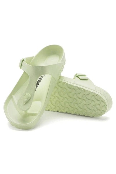 pair of faded lime birkenstock T style rubber slide on beach sandals