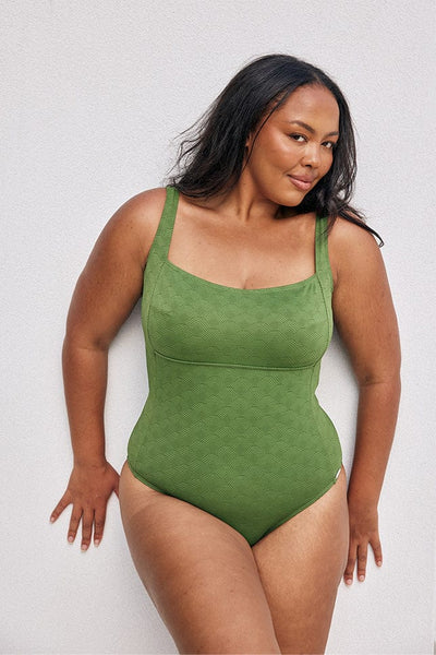 Model wearing textured green square neck one piece 
