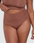 Brown high-waisted bikini bottom on a plain background