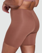 Brown shapewear shorts on a plain background