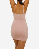 Beige bodycon dress worn by a person on a white background