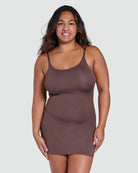 Woman wearing a brown shapewear dress against a white background