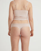 Beige lingerie set on a plain background