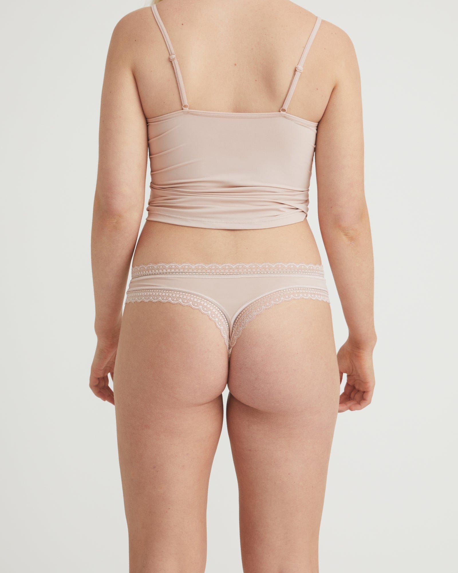 Beige lingerie set on a plain background