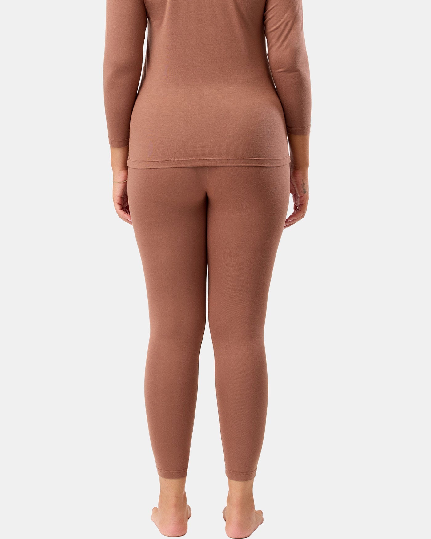Brown long-sleeve top and leggings set on a white background
