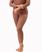 Brown long-sleeve top and leggings set on a white background