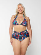 Blonde model in studio wearing high waisted multicoloured bikini bottom with floral print