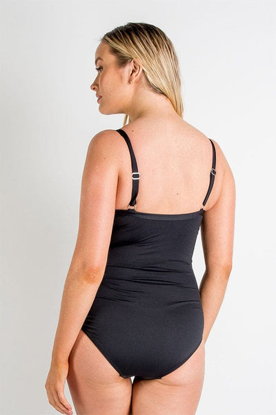 Blonde model show back of black one piece swimsuit