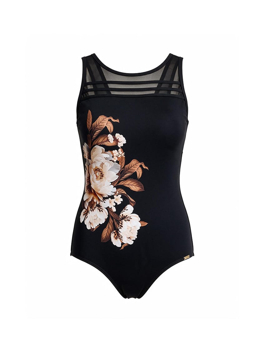 A black one-piece swimsuit featuring a large floral print in white, beige, and brown on the left side, with sheer black mesh shoulder straps, shown against a plain white background.
