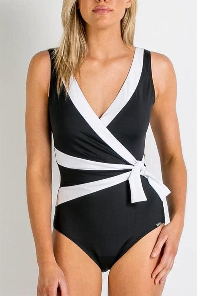front of model in black crossover one piece with wide white trims to accentuate the waist