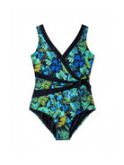 One-piece swimsuit with tropical leaf pattern on a white background